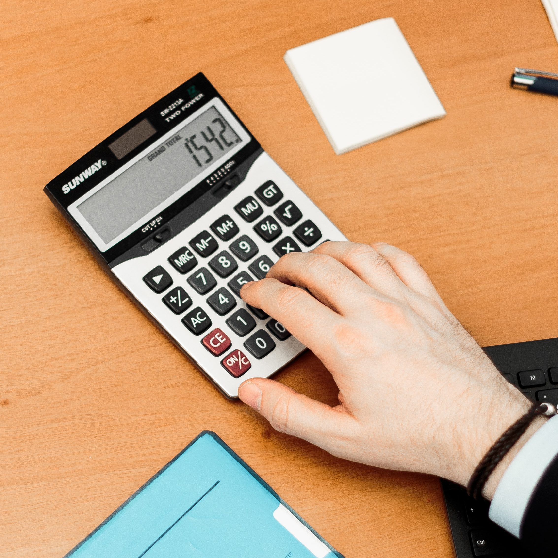 Accountant operating a calculator
